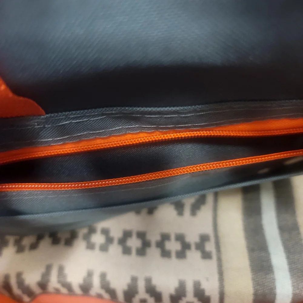 Vibrant Green and Orange Travel Bags for Adventurers